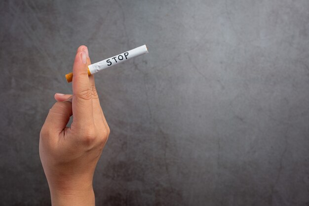 human-hand-holding-cigarette-world-no-tobacco-day-concept